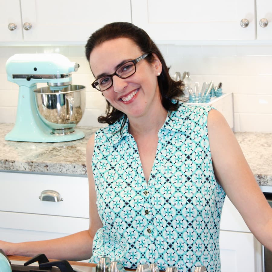 valerie standing in the kitchen behind the stove