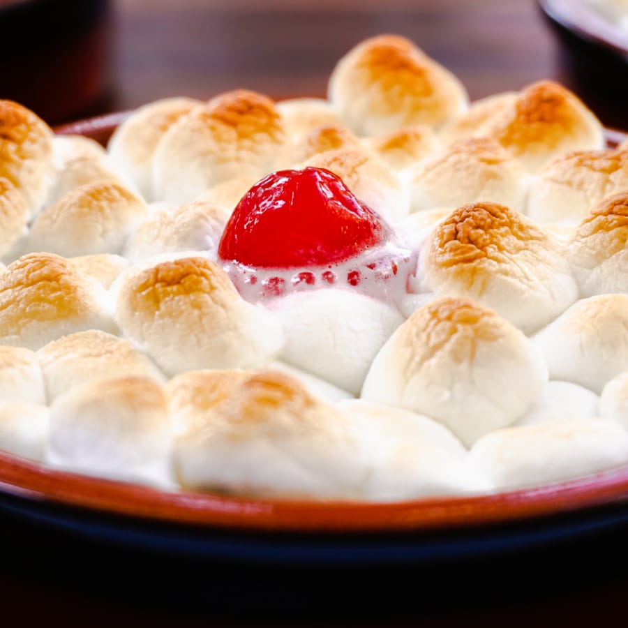 fresh baked sweet potato casserole with toasted marshmallows on top