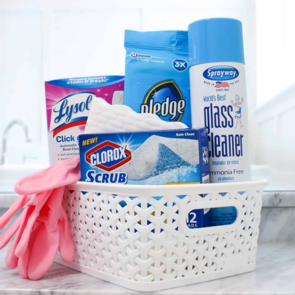 a basket of cleaning items from lysol, pledge, clorox, and spraway