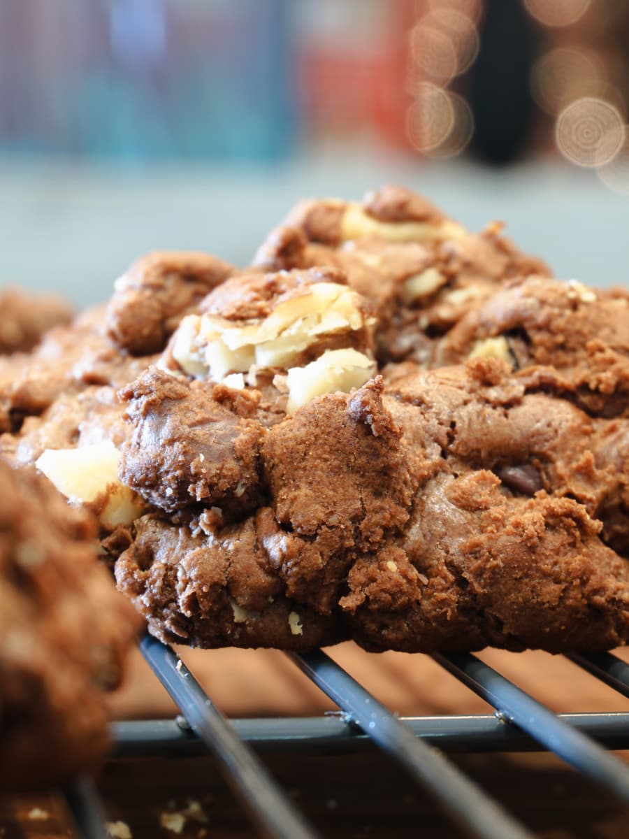 Monster fudge nut cookies cooling on a cookie rack.