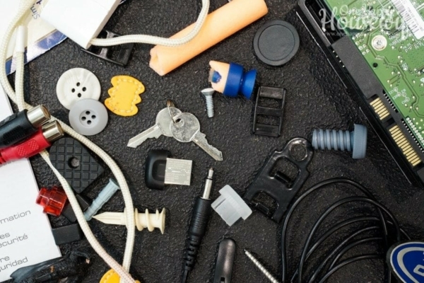 junk cords, cables, buttons, screws, electronic parts, instruction manuals