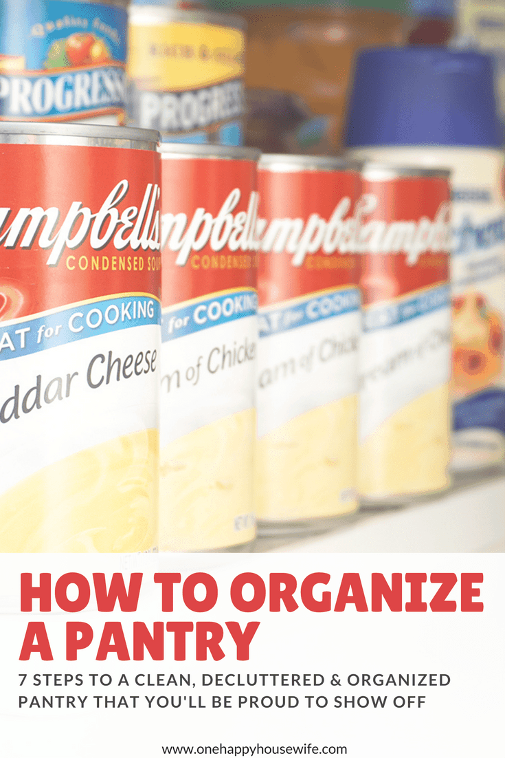 a row of campbells soup cans neatly organized in the pantry