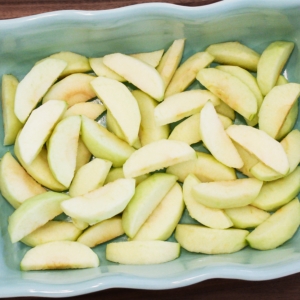 sliced apples placed in a baking dish