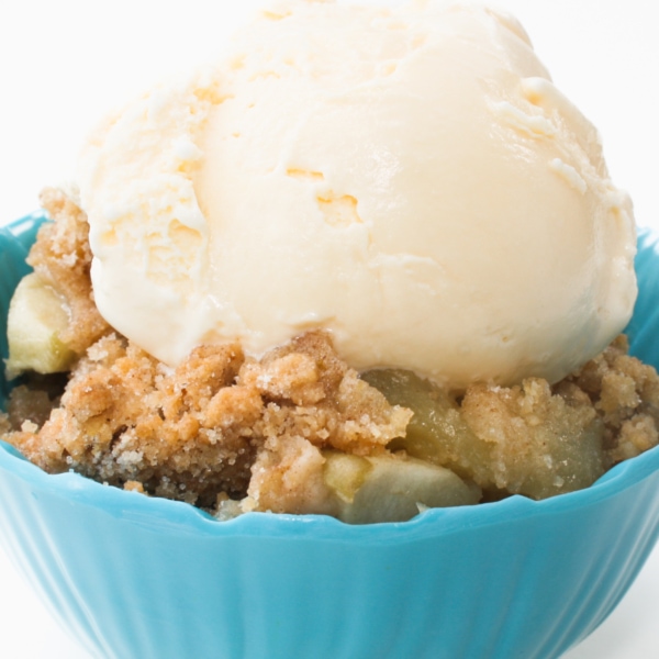 apple crumble served in a small bowl.