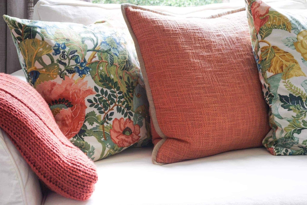 A white sofa is perfect for easily swapping out colorful decor.