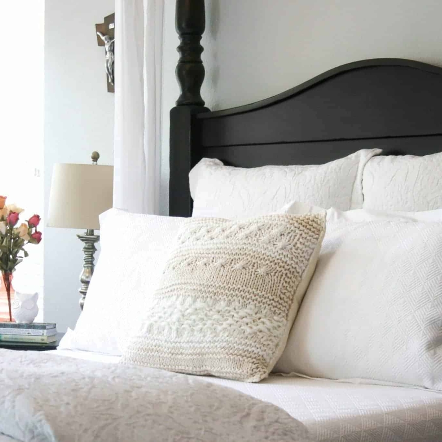 White bedding is the perfect backdrop for colorful throw pillows.