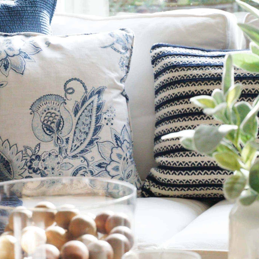 A white sofa is the perfect backdrop to color throw pillows and throw blankets.