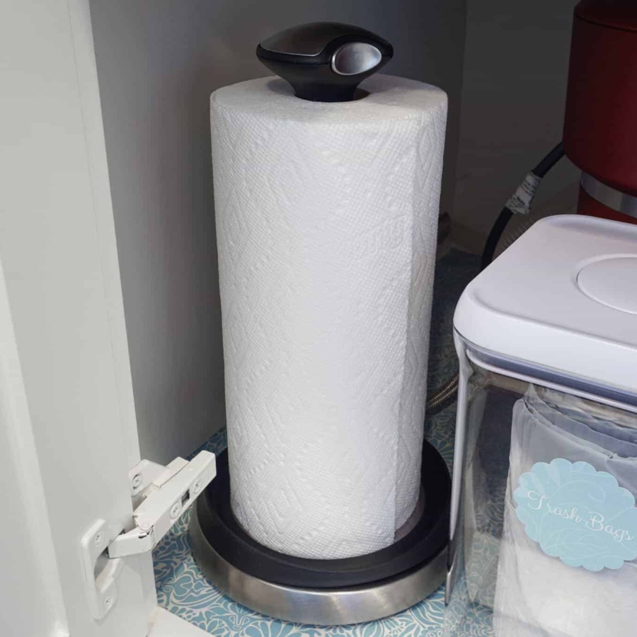 Paper towel holder under kitchen sink.