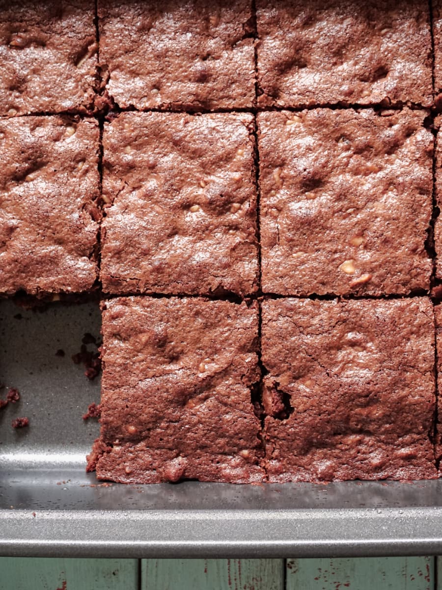 overhead shot of sliced brownies in a baking dish