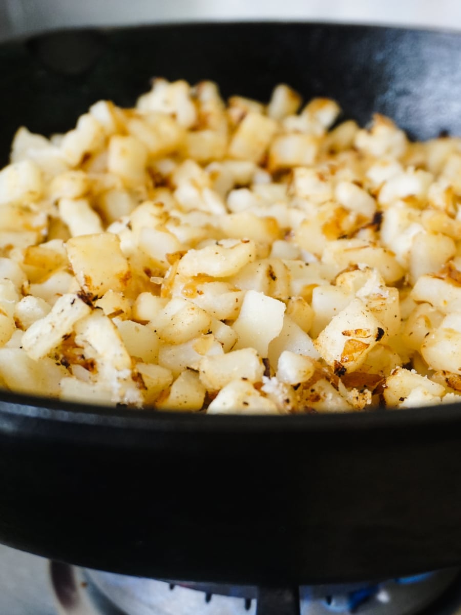 Seasoning potatoes with Pop and Cook.