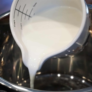 pouring whole milk into the instant pot