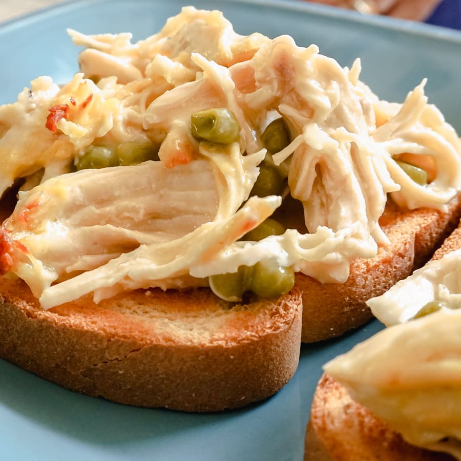 close up of chicken a la peasant served on a piece of toast