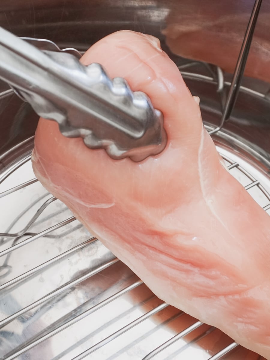 placing thawed chicken breasts on the trivet in the instant pot