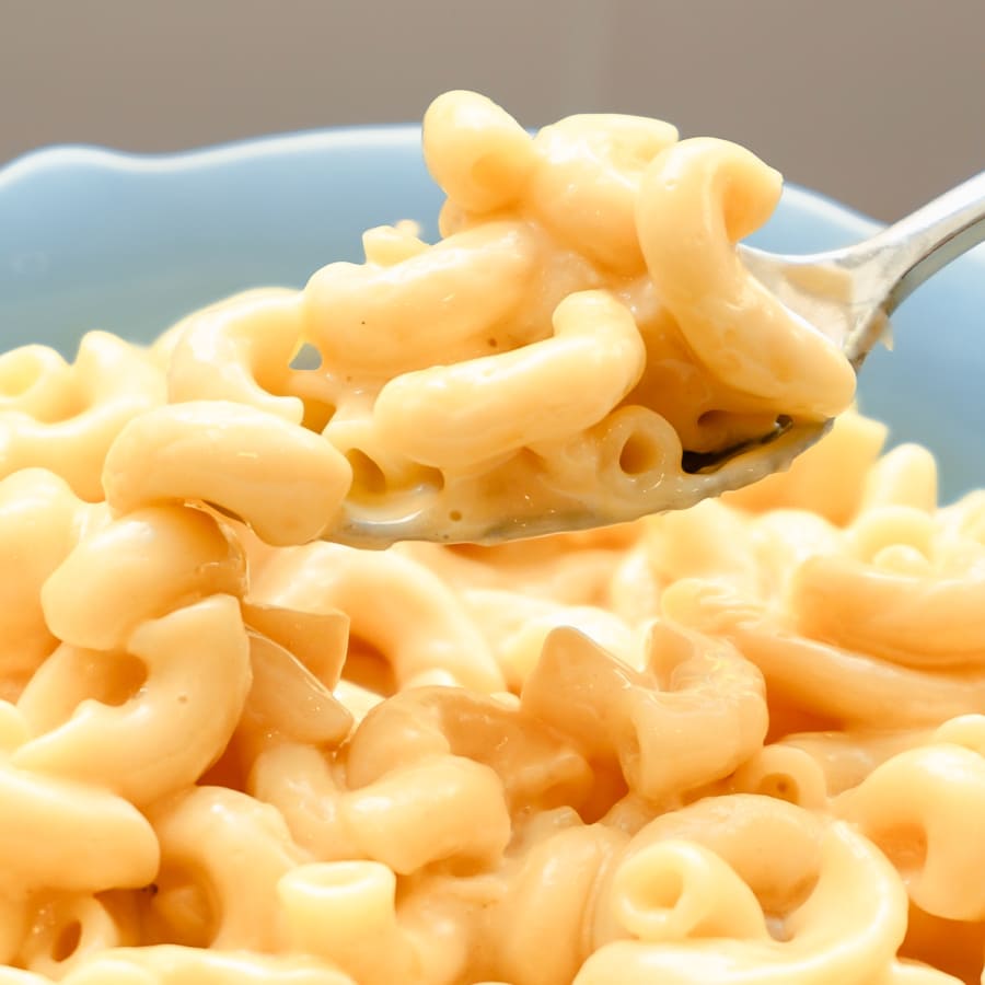 top view of a bowl of homemade mac and cheese on top of a plate