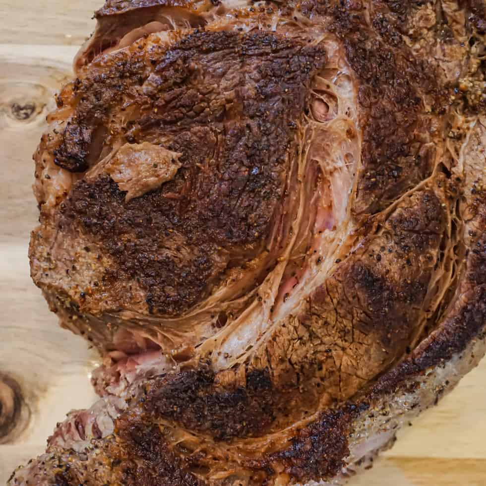 overhead shot of a seared chuck roast sitting on a cutting board