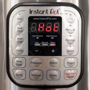 the digital display on the instant pot reading Hot