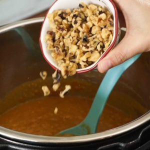 Adding chopped walnuts to this Instant Pot sweet potato casserole.