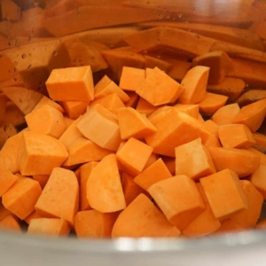 Cubed sweet potatoes for Instant Pot sweet potato casserole.