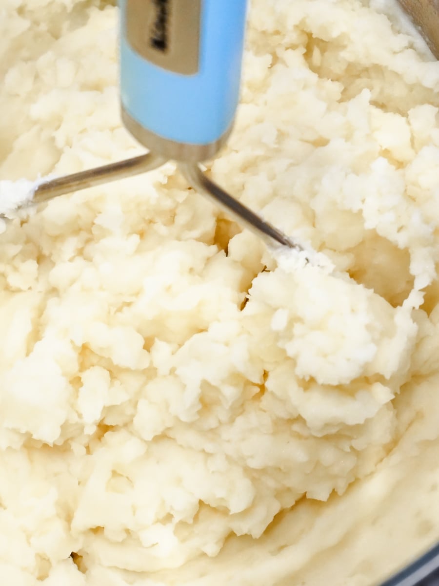 mixing in the milk and butter to the mashed potatoes in the instant pot