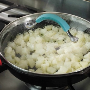 Cooking potatoes for beef and potato empanadas