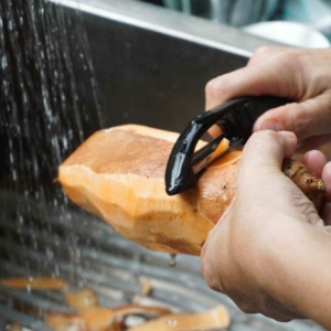 Peeling sweet potatoes for the sweet potato casserole