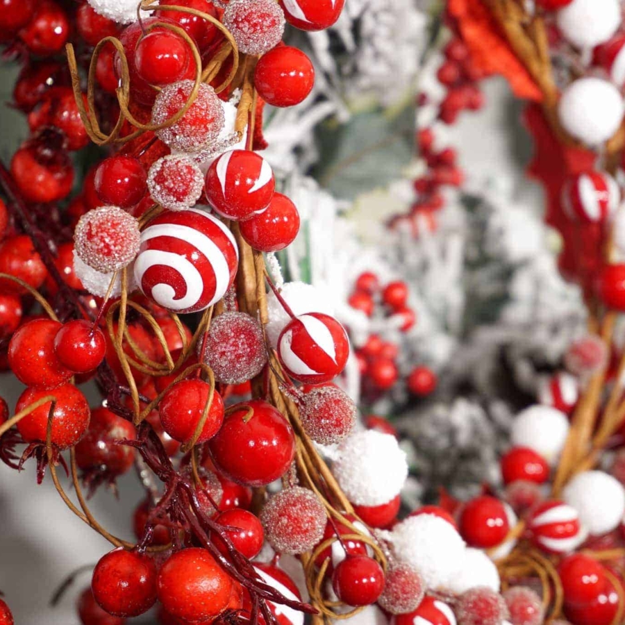 decorating a Christmas mantel with wreaths