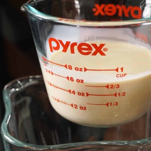 adding condensed milk to blender