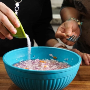 making the best habanero salsa recipe in a blue prep bowl