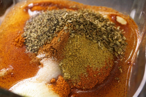 all the ingredients for the sauce used for making cochinita pibil pulled pork are in the blender ready to be blended before adding to the instant pot