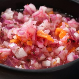 a bowl full of habanero salsa made using this recipe