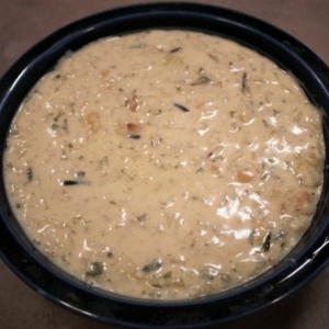 a bowl filled with chicken and rice soup