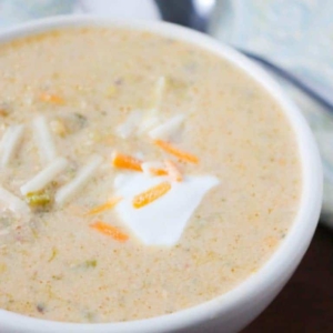 a large serving of chicken broccoli and cheese soup in a bowl