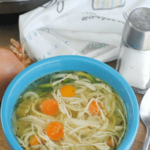 a small bowl of homemade chicken zoodle soup