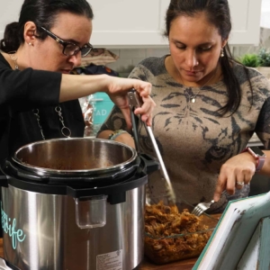 shredding the pork shoulder that just came out of the instant pot for making the pork carnitas, cochinita pibil