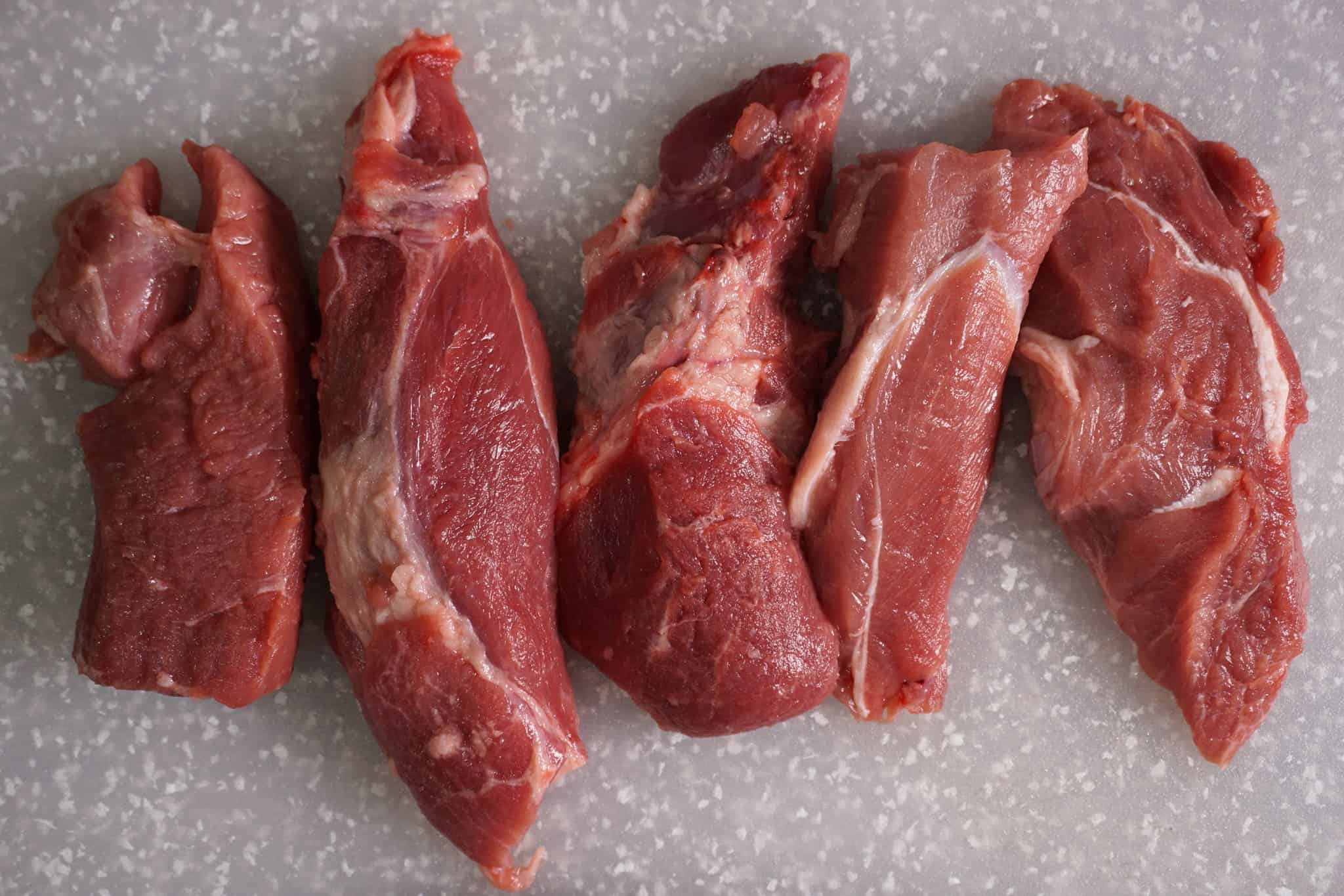 slices of raw pork shoulder