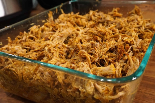 instant pot shredded pork in a pyrex