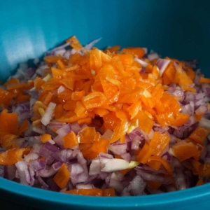 all the ingredients for mexican habanero salsa in a bowl