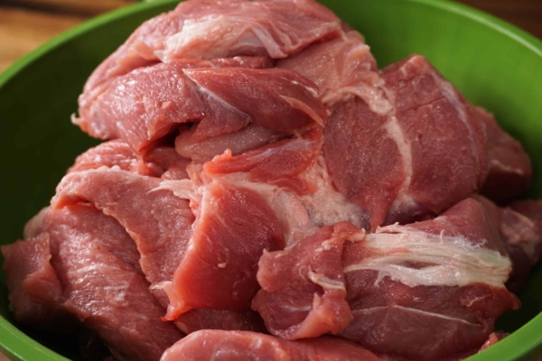 a bowl of pork shoulder strips ready to go into the instant pot pressure cooker and make cochinta pibil carnitas