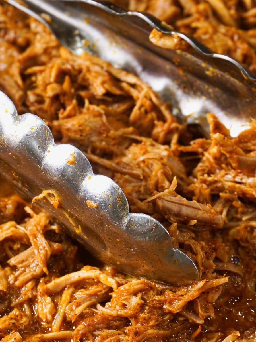 a pyrex full of shredded pork roast