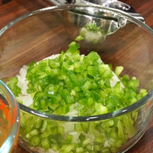 a bowl of chopped onion and green bell pepper