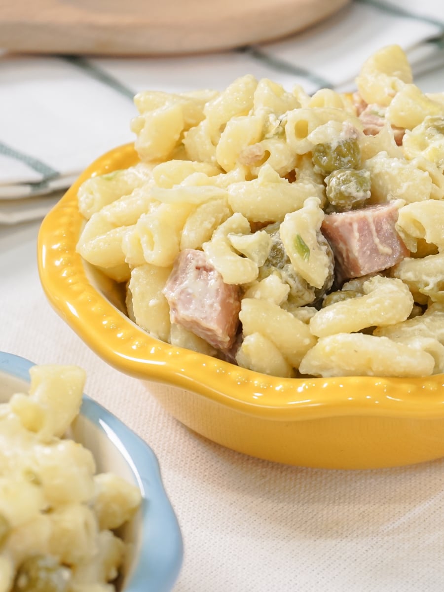 close up of two bowls filled with creamy macaroni salad