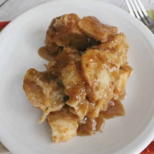 closeup of caramel pumpkin spice bread pudding on a plate