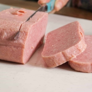 slicing the spam for this easy pasta salad recipe