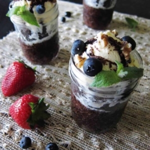 fudgy brownie sundaes in a jar topped with blueberries