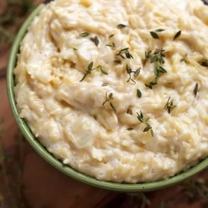 a bowl of cheesy garlic orzo