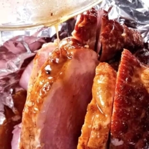 close up of glazed and juicy maple bourbon ham