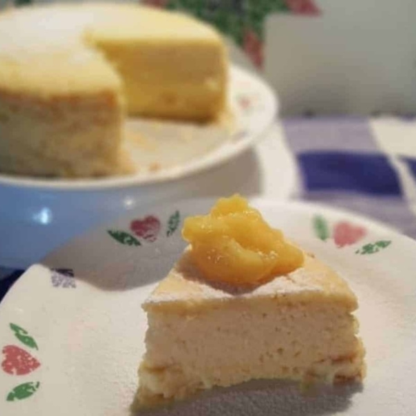 a small slice of italian meyer lemon ricotta cheesecake on a plate