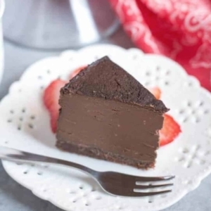 close up of a slice of keto chocolate cheesecake