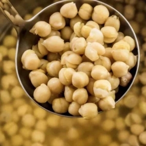 a ladle of chickpeas from the instant pot