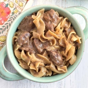 overhead shot of beef noodles in a small bowl